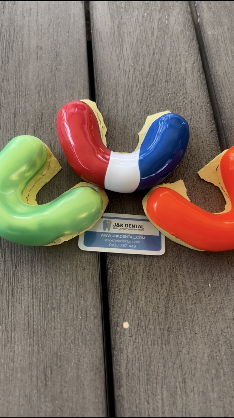 Custom mouthguards in green, red, blue and orange