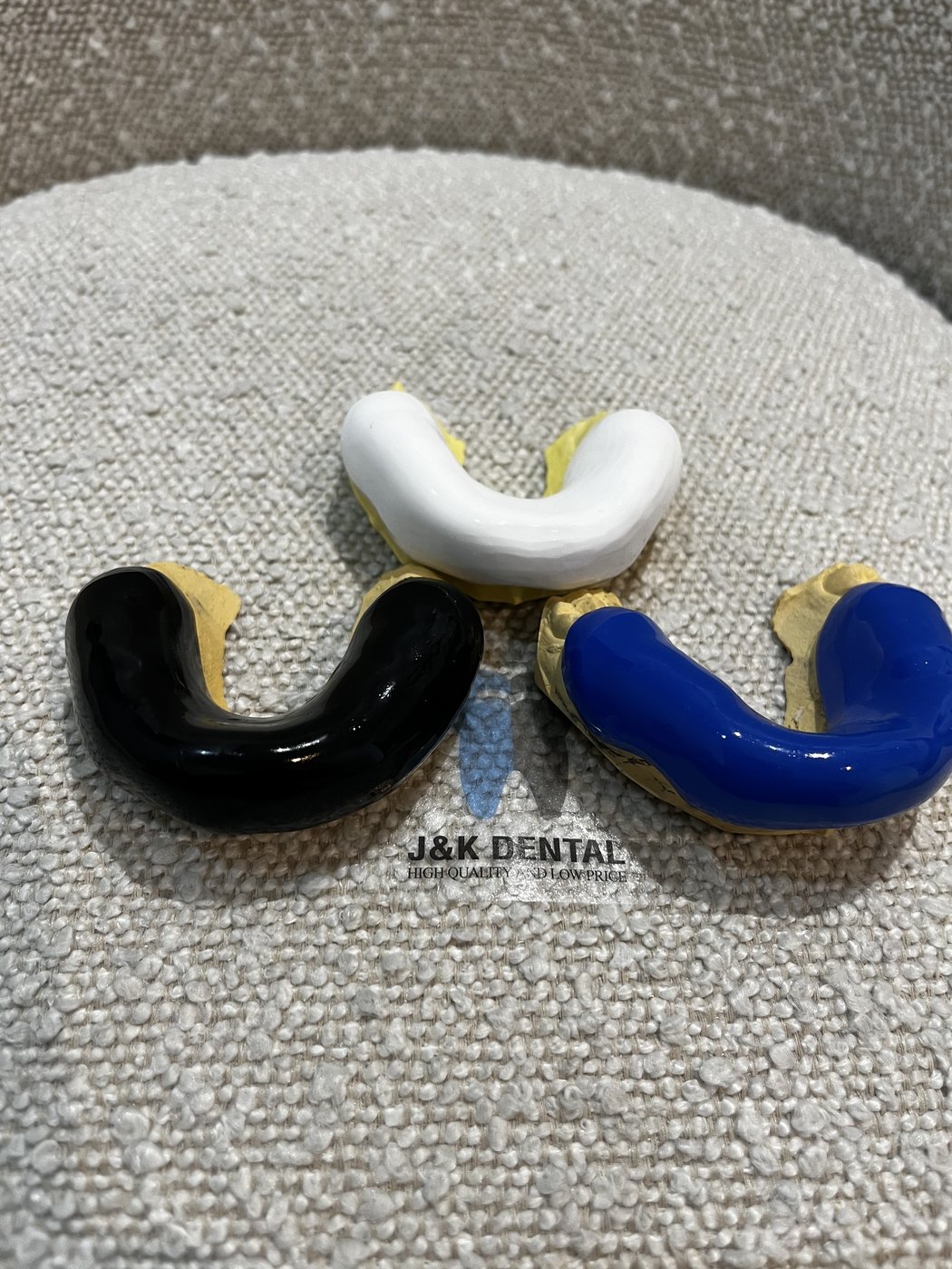 Custom mouthguards in white, black and blue